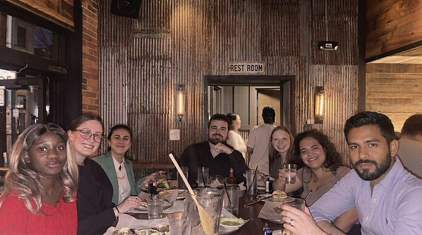 Team sharing dinner together at a Columbus restaurant