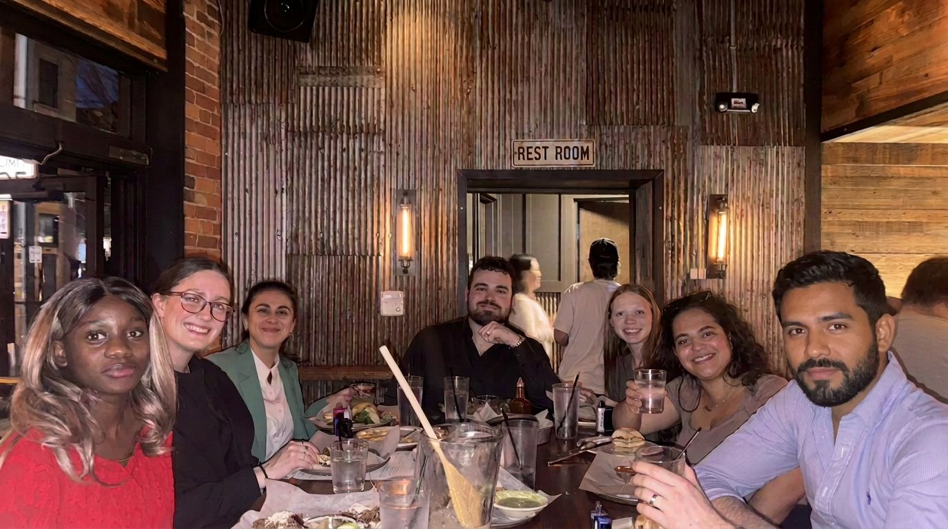 Team sharing dinner together at a Columbus restaurant