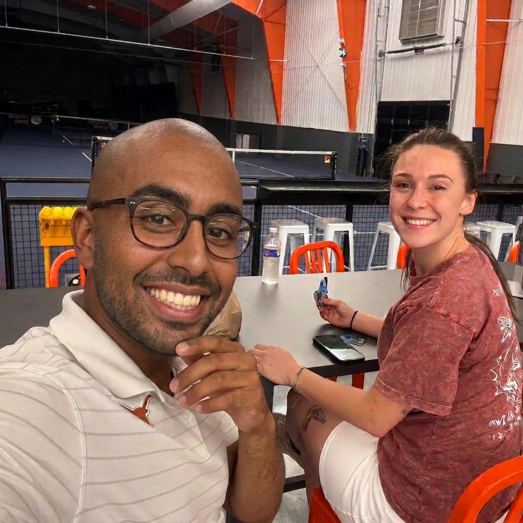Two team members talking at a table during a team outing