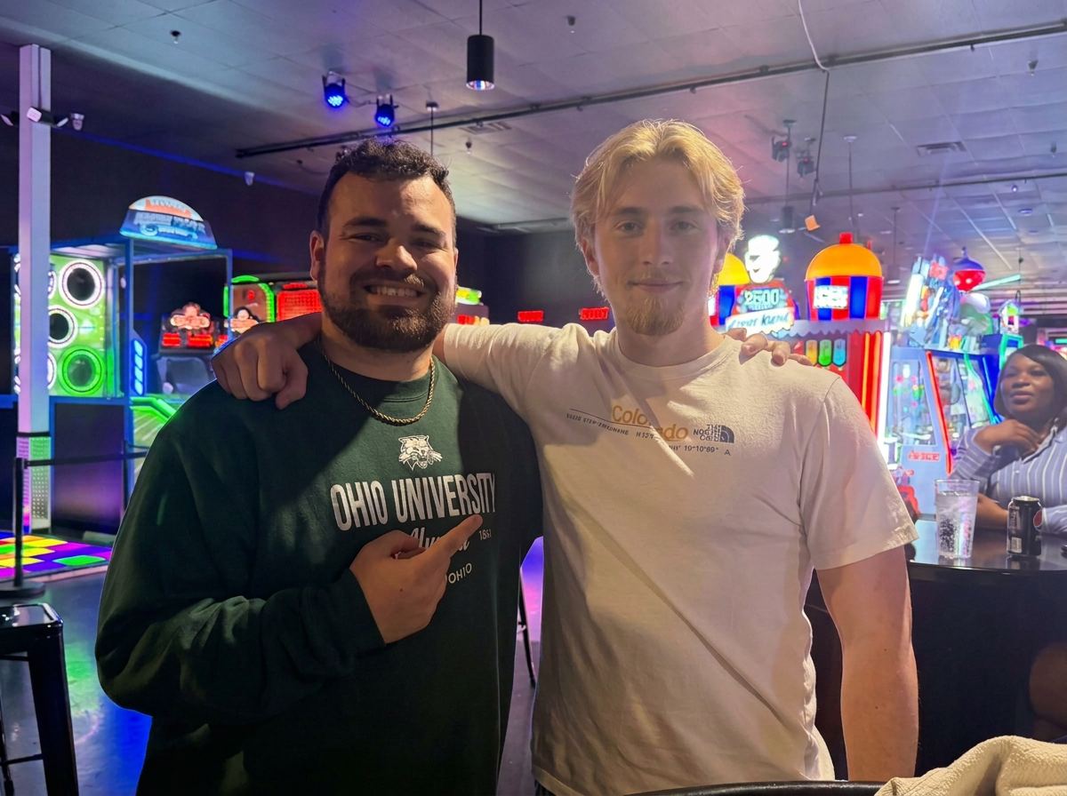 Two teammates side by side at a team night out